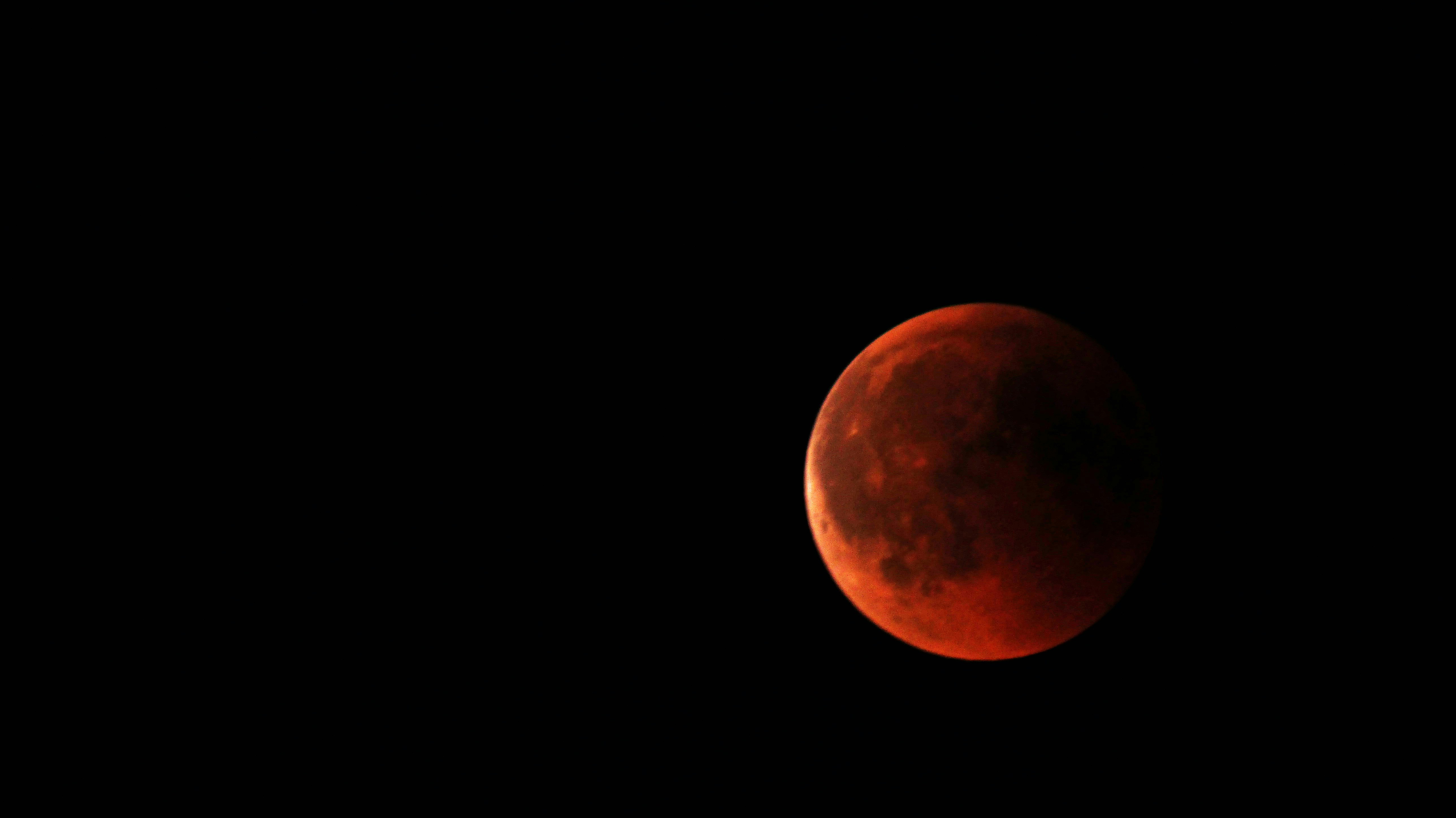 Really struggled with my camera to take the picture. My equipment is definetly not made for capturing such a scene. Though, I am pretty happy with the result.\r
Shot this on Juli 27th 2018 at 23:30 MEST. It was the night with the longest lunar eclipse of the 21st century at my location. At the same time the Mars was really near the Earth and appeared as bright orange/red “star” just a little bit beneath the Moon. What a great night. Happy to was there, happy to be able to watch this spectacular phenomenon.